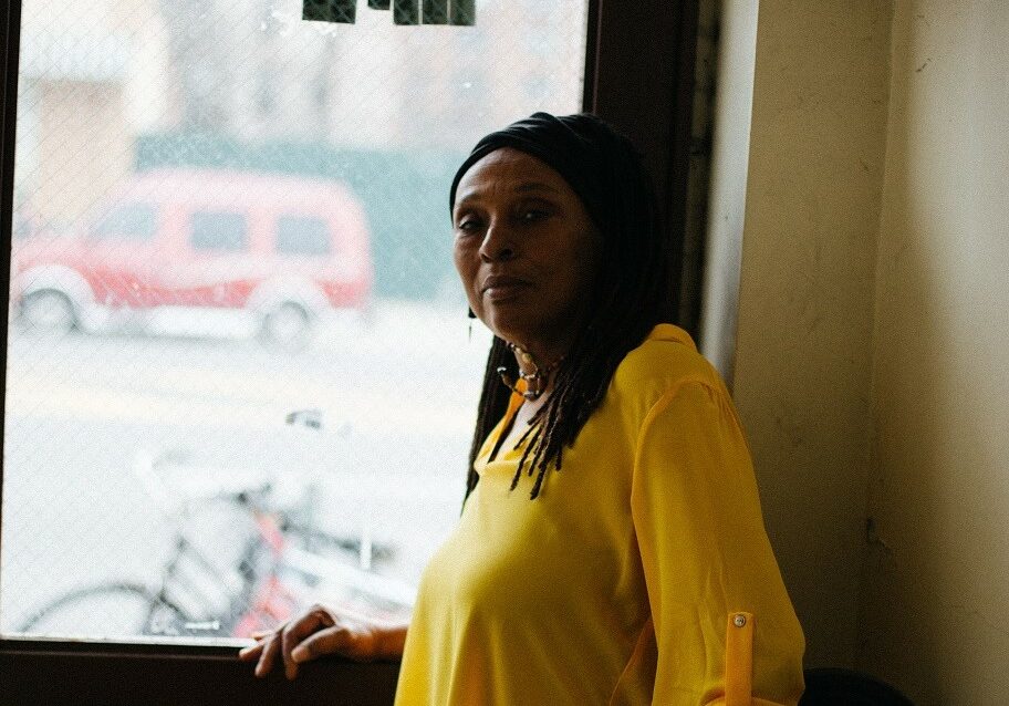 Woman standing in door frame